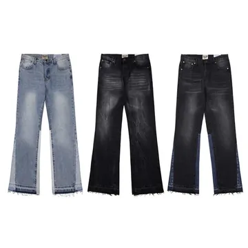 Three pairs of flared jeans in light, mid and black washes laid flat on white.